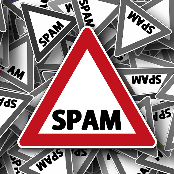 An image that displays a warning sign with the word Spam on it.